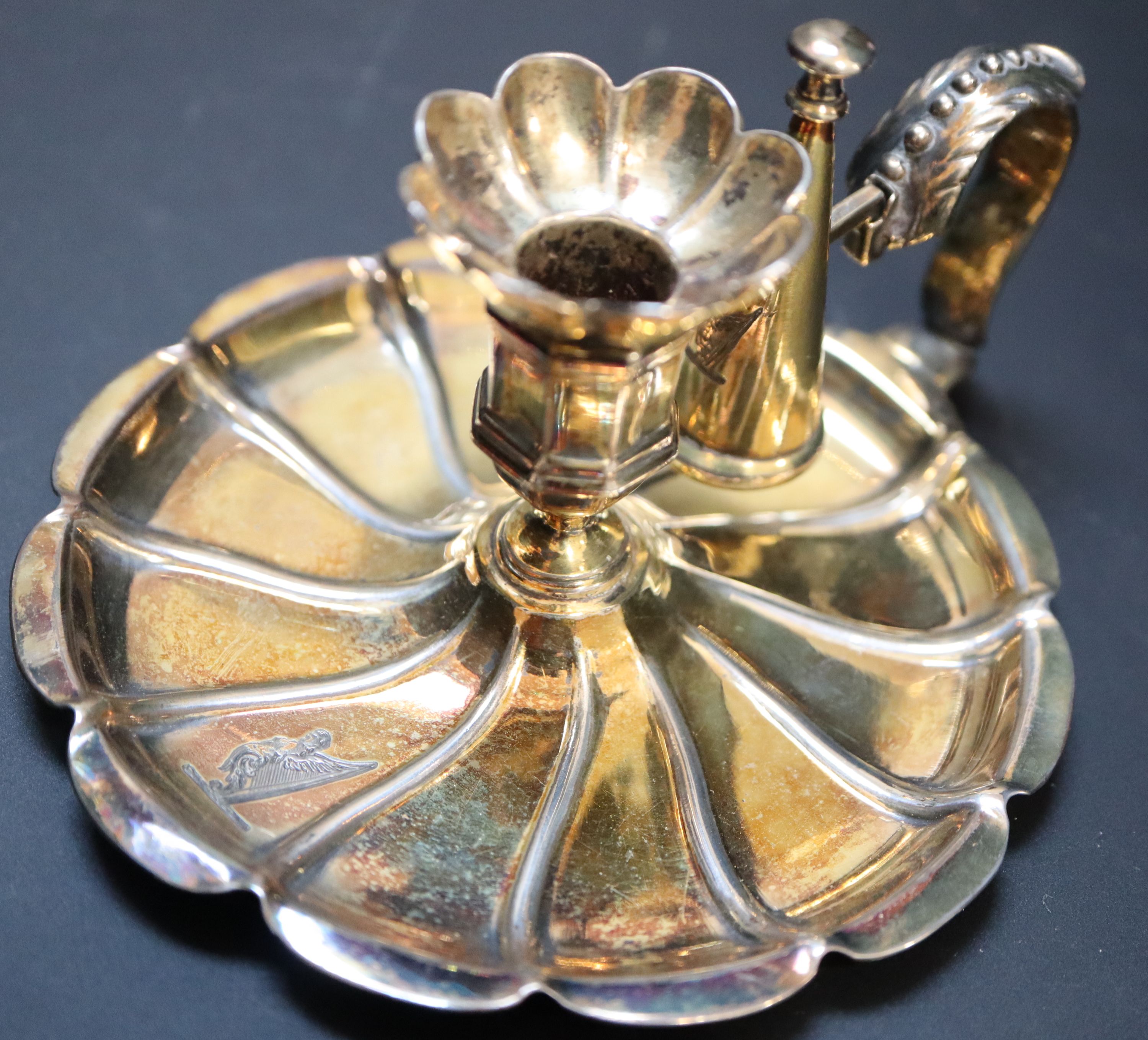 A Victorian silver gilt miniature chamberstick, height 6.5cm, 4oz.